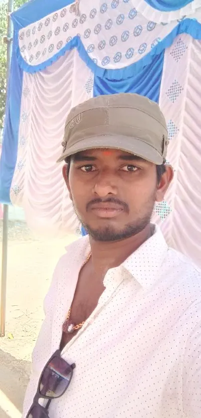 Selfie with colorful blue festival drapes.