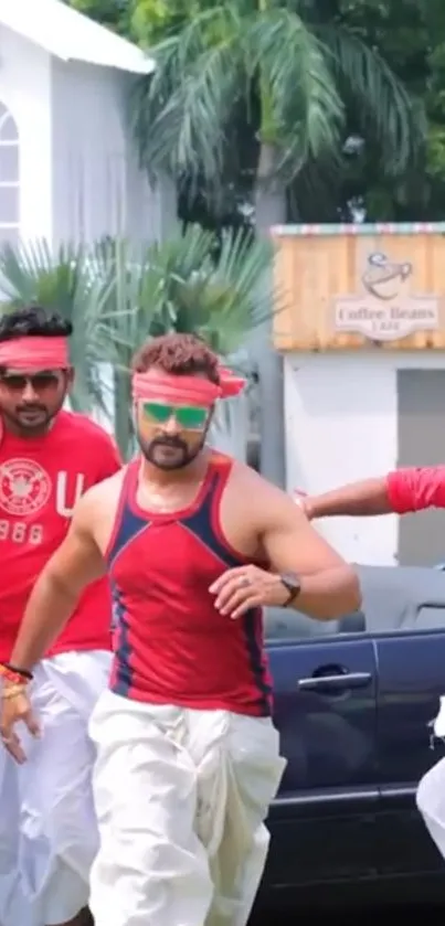 Men wearing red attire celebrating outdoors with energy and style.