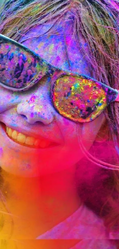 Joyful face with vibrant Holi colors, wearing sunglasses.