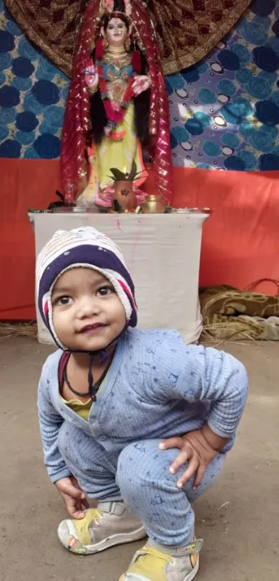 Joyful toddler in colorful festive setting.