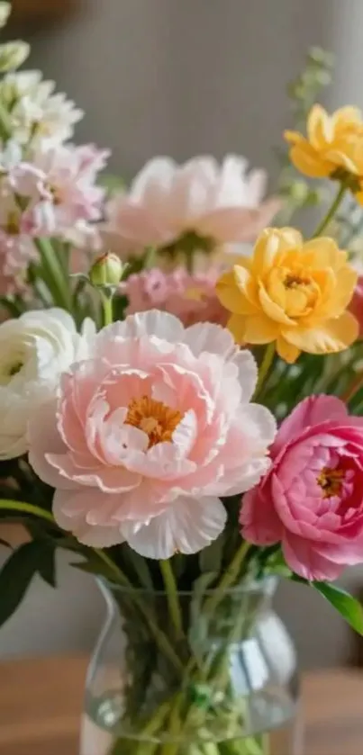 Vibrant floral bouquet with pink, yellow, and white flowers in a vase.