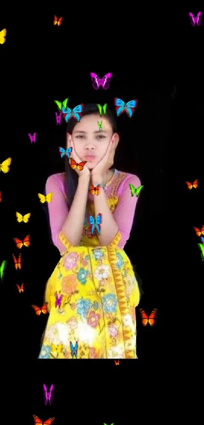 Woman in a colorful floral dress with a black background.