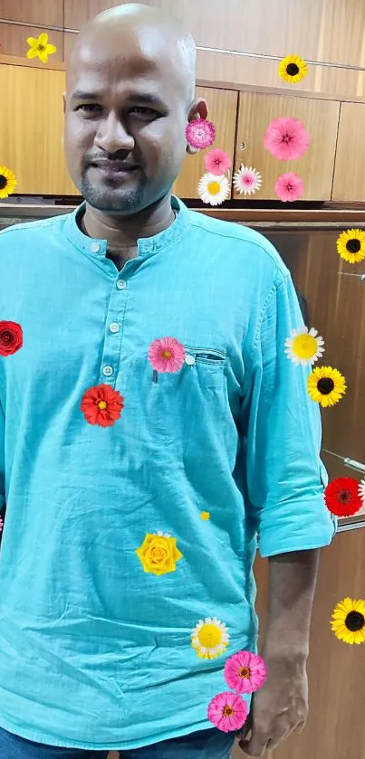 Person wearing a turquoise shirt with vibrant floral design.