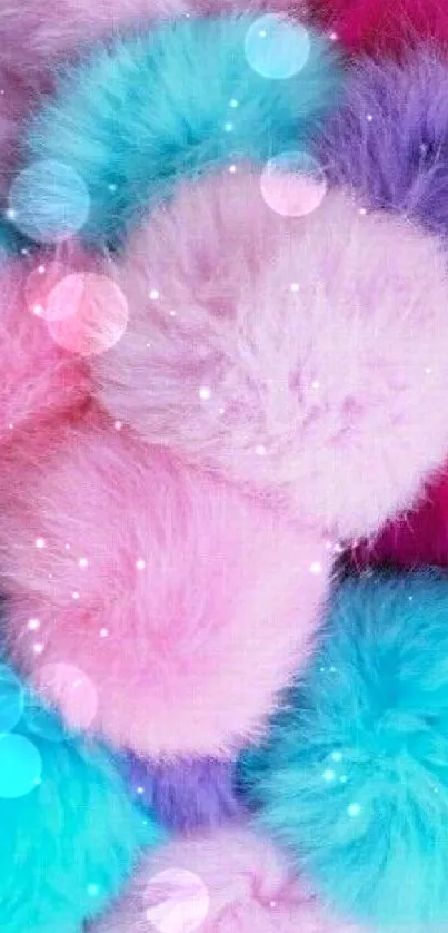 Colorful fluffy pom-poms in pink, blue, and purple on mobile wallpaper.