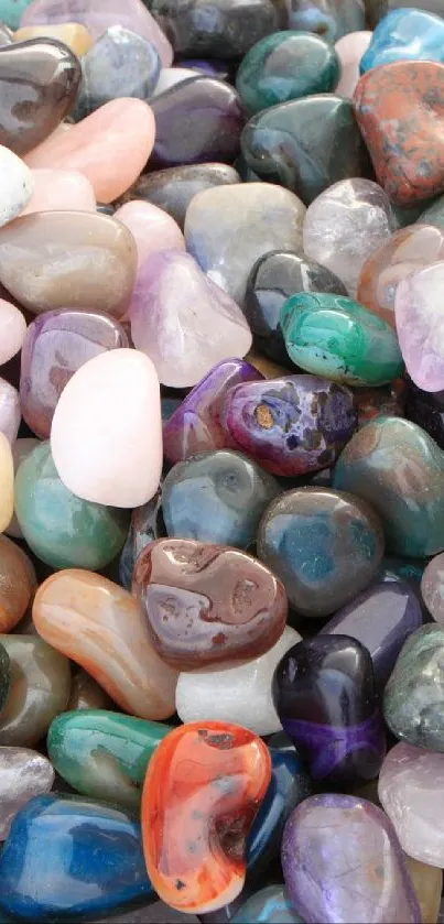 Assorted colorful gemstones displayed on a surface, creating a vibrant wallpaper.