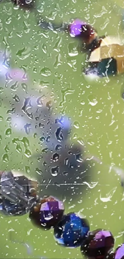 Colorful crystal beads on green backdrop with raindrops.