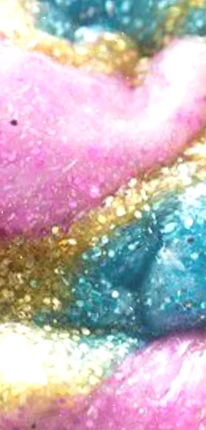 Colorful glitter swirl with pink, blue, and gold hues.