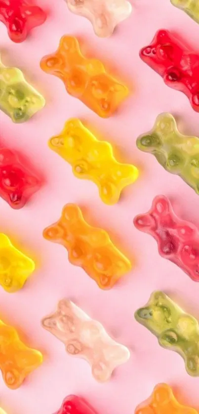 Playful wallpaper with colorful gummy bears on pink background.