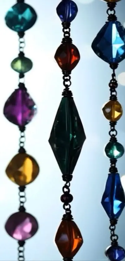 Colorful hanging jewels against a blurred background.