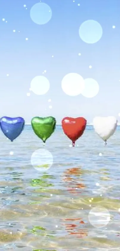 Colorful heart-shaped balloons floating over a bright sea.