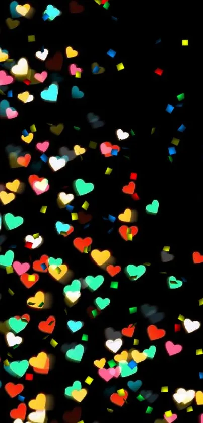 Colorful heart bokeh on a black background.