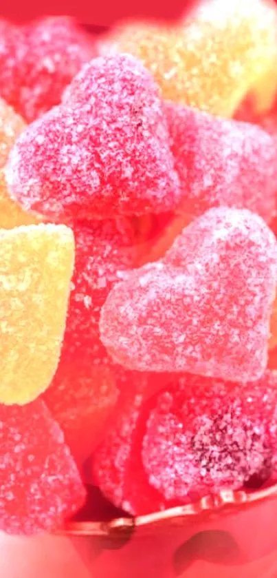 Heart-shaped colorful candies in a bowl create a sweet and vibrant wallpaper.
