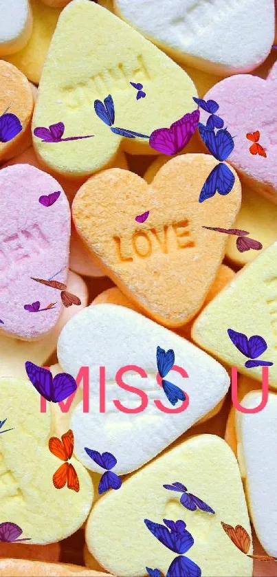 Heart-shaped pastel candy with 'I MISS U' message.