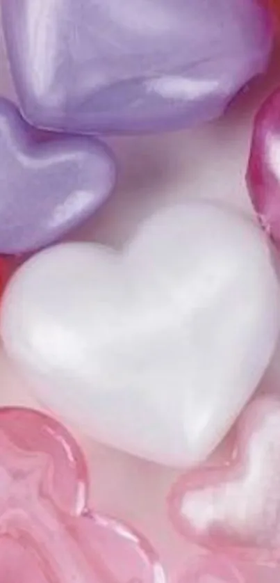 Mobile wallpaper with colorful candy hearts.