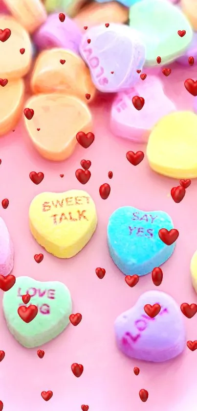 Pastel heart candies on pink background.