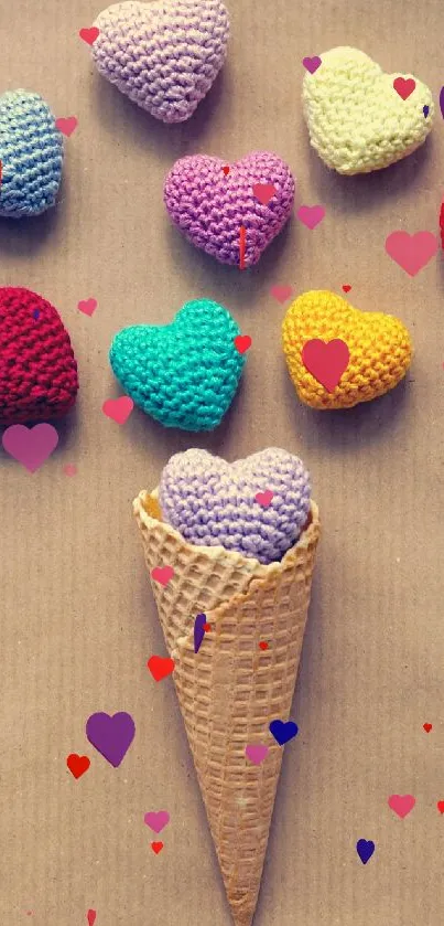 Wallpaper of colorful crocheted hearts in a cone on a beige background.