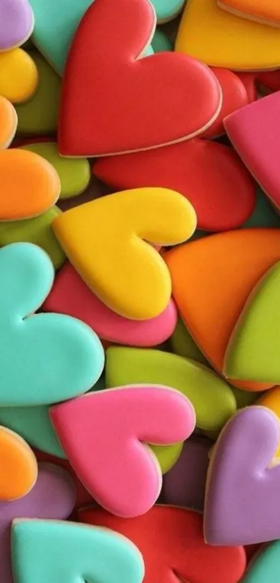 Colorful heart-shaped cookies wallpaper with vibrant red, blue, yellow, and green tones.