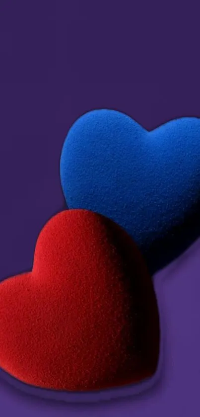 Abstract wallpaper with red and blue hearts on a purple backdrop.