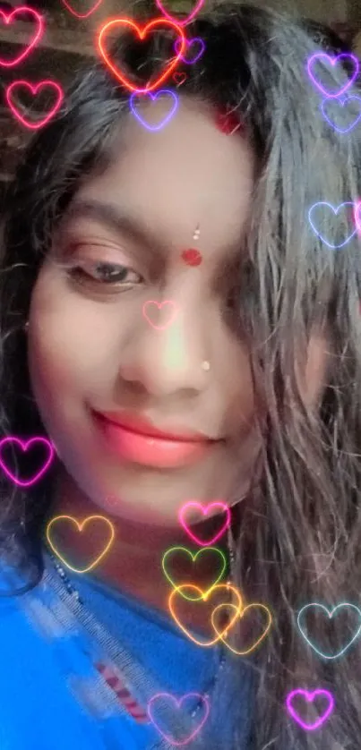 Vibrant portrait with colorful heart filters on blue background.