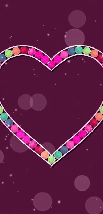 Colorful heart gem design on purple background wallpaper.