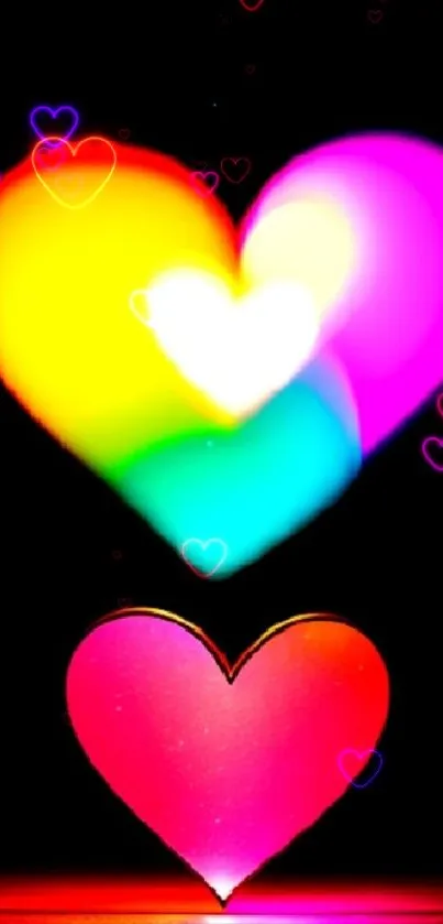 Two glowing multicolored hearts on a black background.