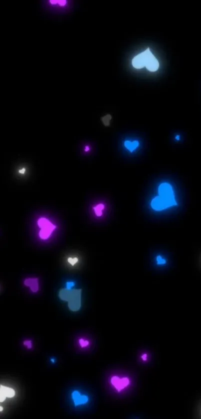 Mobile wallpaper with glowing blue and purple hearts on a black background.