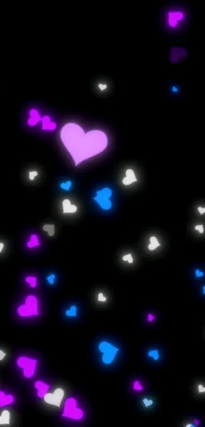 Glowing hearts in pink, blue, and white on a dark background.