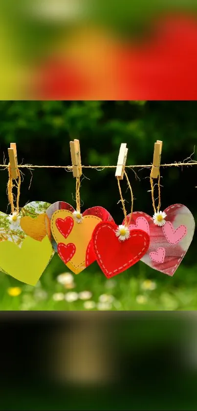 Colorful hearts hanging in nature setting.