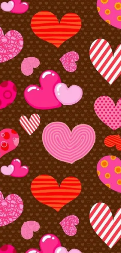 Vibrant mobile wallpaper with pink and red hearts on a brown background.