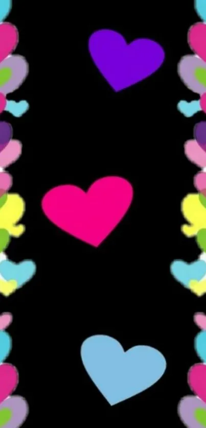 Colorful hearts on black wallpaper design.