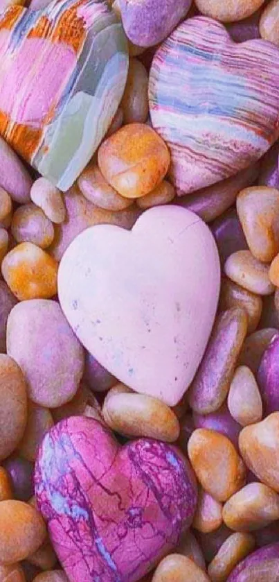 Vibrant heart-shaped pebbles on stones background.