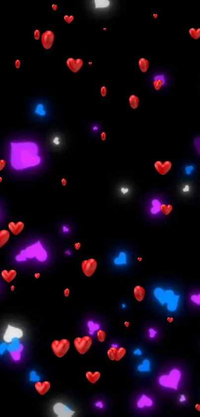 Colorful hearts floating on black background wallpaper.