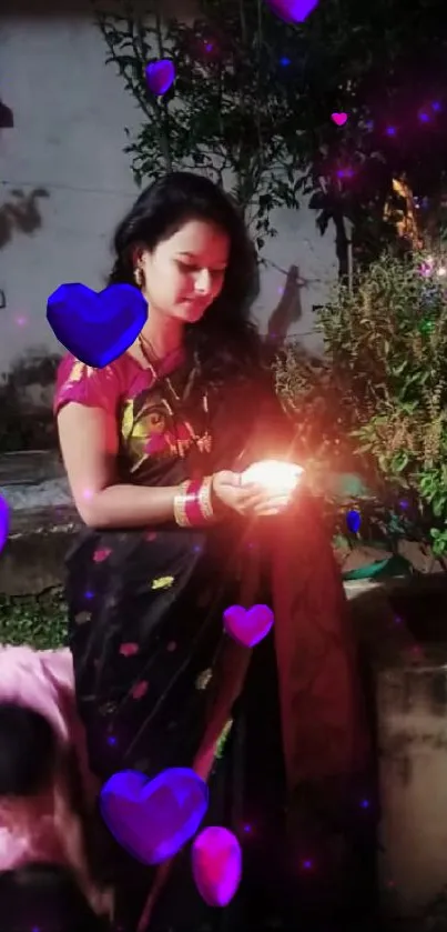 Woman holding light with purple hearts around her.