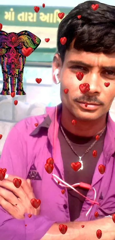 Man in purple shirt with red hearts and artistic elephant design.