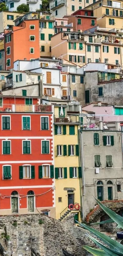 Colorful hillside village with vibrant buildings.