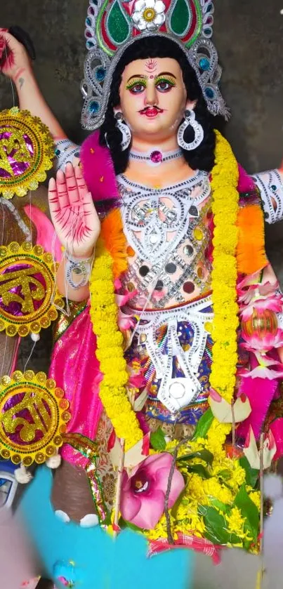 Vibrant Hindu deity with colorful attire and traditional icons.