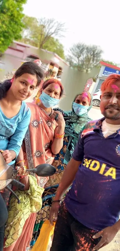 Group enjoying Holi with vibrant colors.