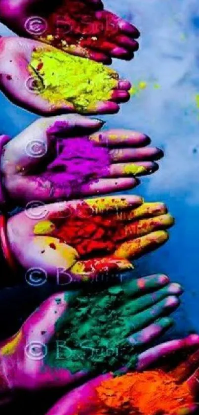 Colorful hands displaying festive Holi colors.