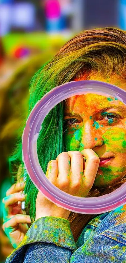 Woman with colorful powder on face during Holi festival.