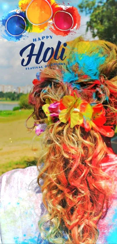 Back of a woman covered in vibrant Holi colors.