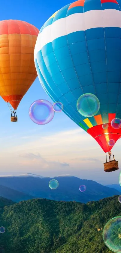 Colorful hot air balloons over green mountains at sunrise.