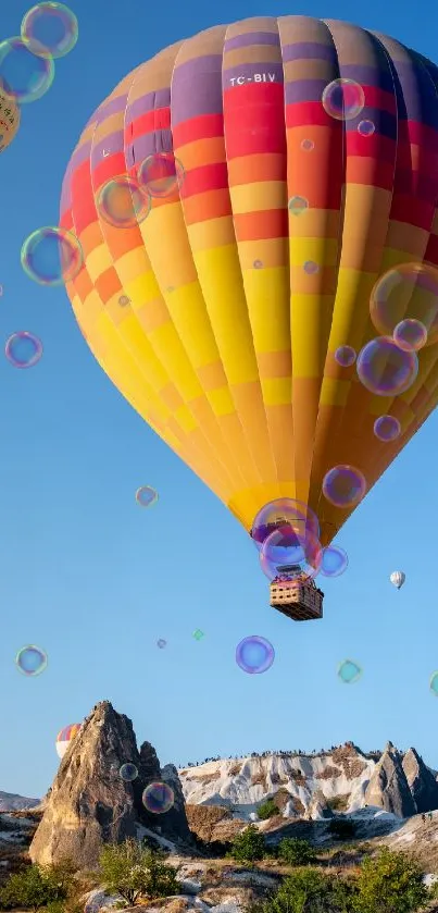 Colorful hot air balloons soar over scenic mountains.