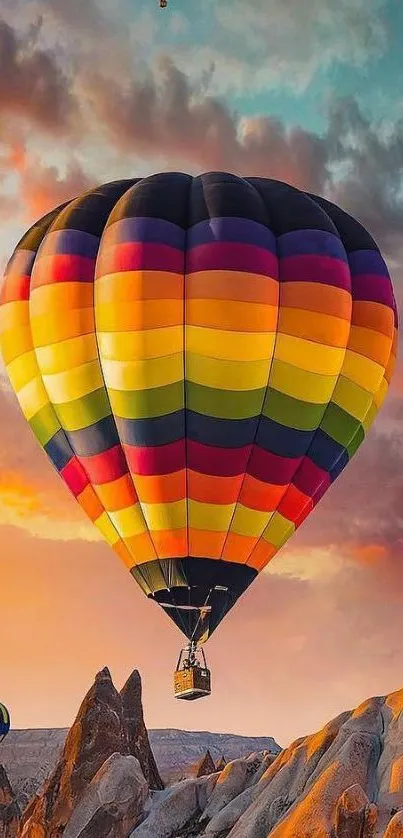 Vibrant hot air balloon over Cappadocia at sunset.