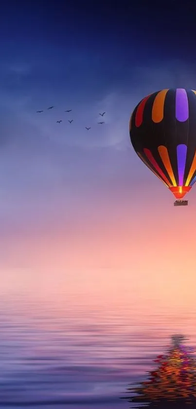 Colorful hot air balloon at sunset over tranquil waters.