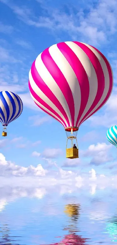 Colorful hot air balloons float in a blue sky over water reflection.