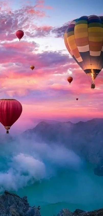 Colorful hot air balloons floating over mountains at sunset.