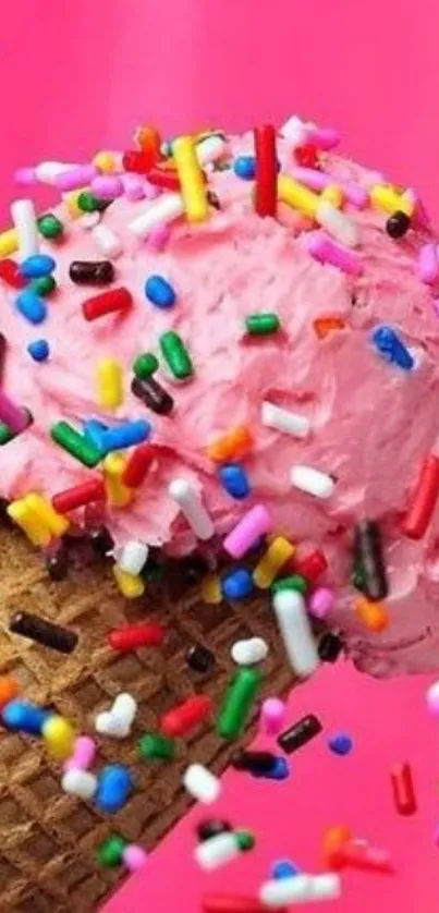 Pink ice cream cone with colorful sprinkles.