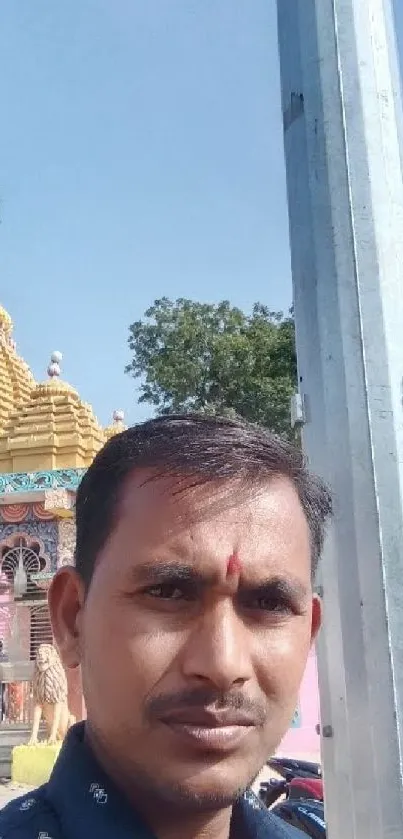 Vibrant Indian temple with colorful architecture under a clear sky.