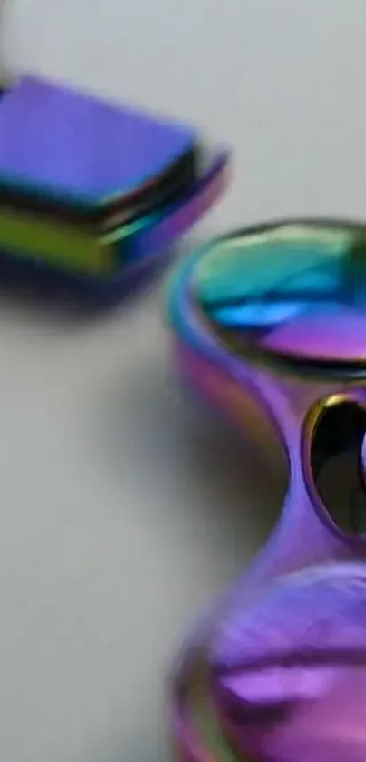 Iridescent fidget spinner with vibrant, colorful design.