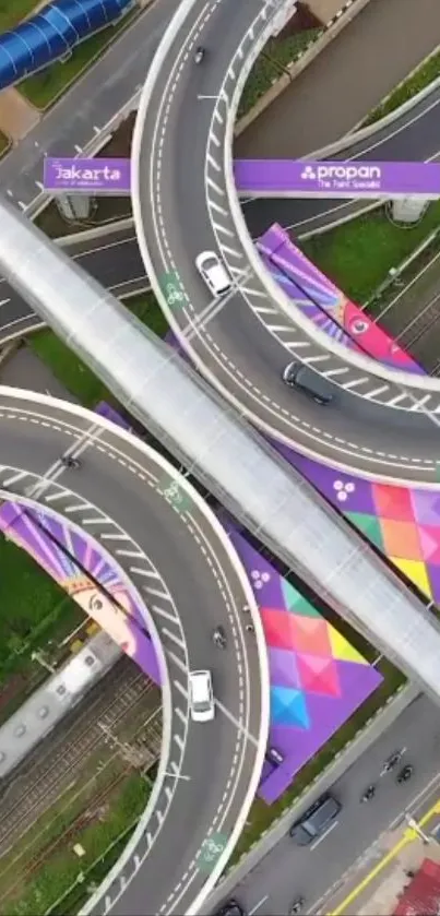 Aerial view of a colorful Jakarta overpass featuring intricate road design.